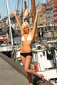 Beautiful blonde babe with amazing blue eyes on sailboat in Copenhagen