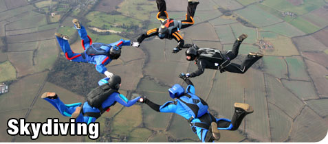 Group of Skydivers Holding Hands