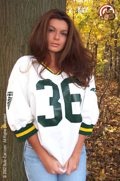 Vicki in jeans and football jersey