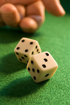 rolling dice on craps table