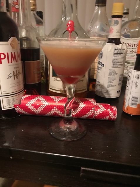 cocktail glass with The Santa Claus Sour