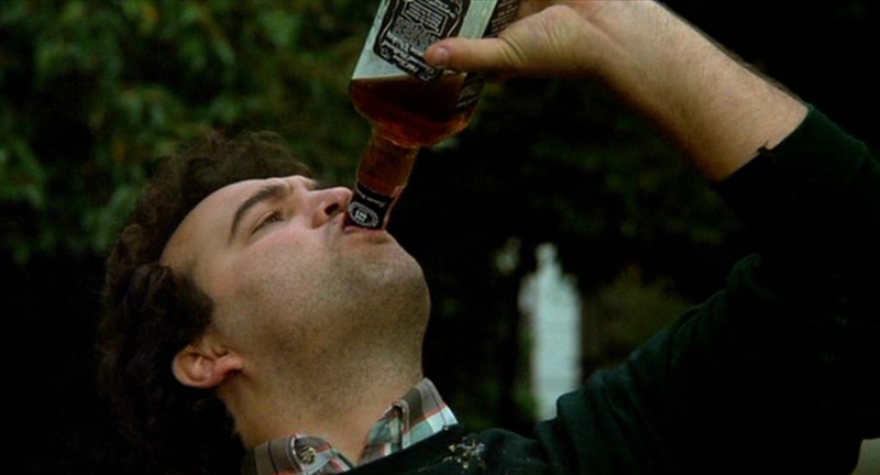 John Belushi driking whiskey in Animal House