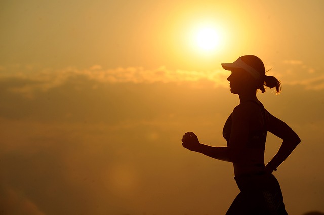 woman jogging at sunset
