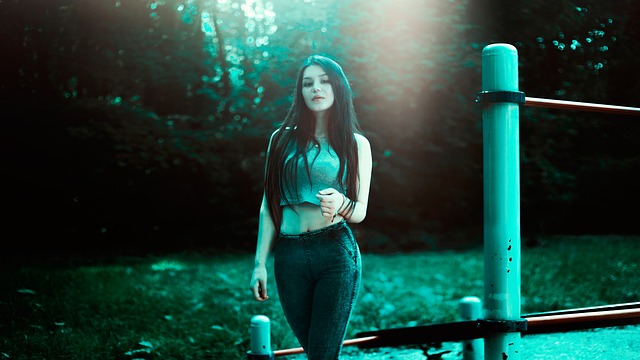 attractive younger woman with dark hair in jeans