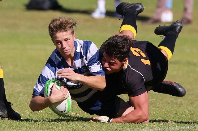 rugby players tackle