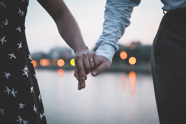 holding hands with ring