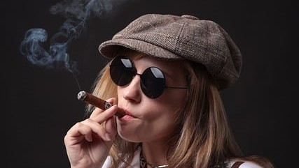 women smoking cigar