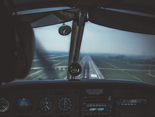 view of airport runway from airplane cockpit