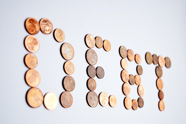 debt spelled with pennies