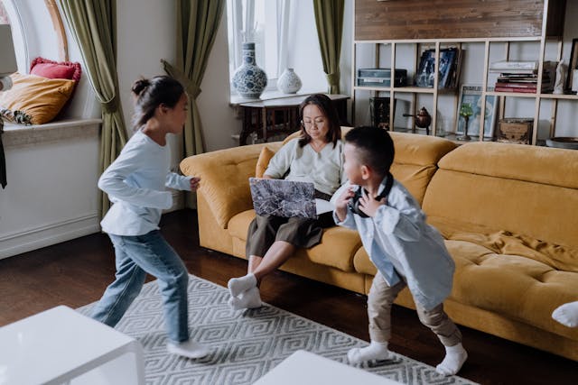 mother and two kids in living room