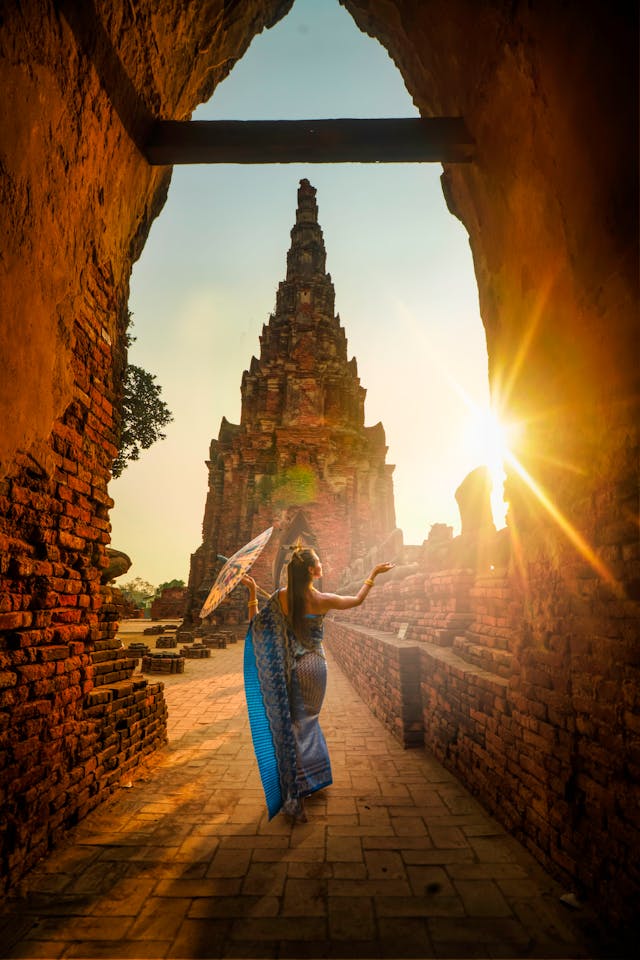 woman in blue dress at sunset