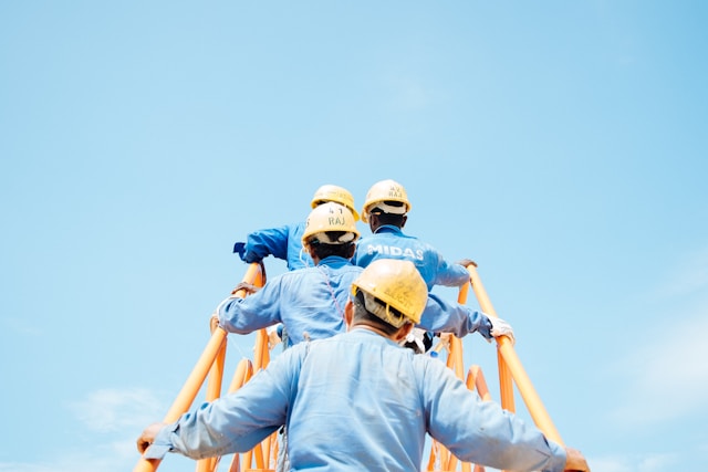 construction workers walking up steps