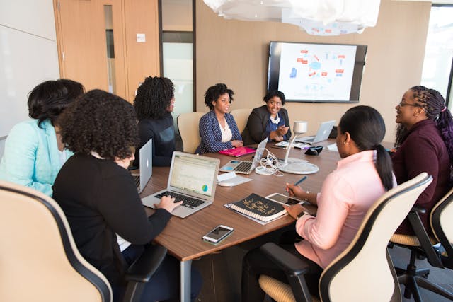 employees having a meeting around a table