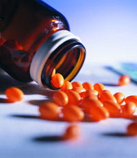 bottle with orange pills