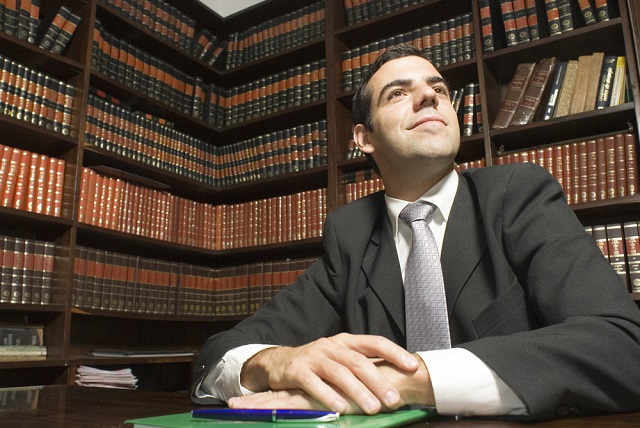 lawyer in room with legal books