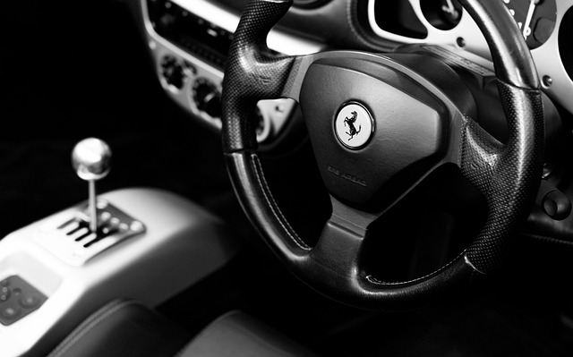 interior view of ferrari steering wheel and gear shifter