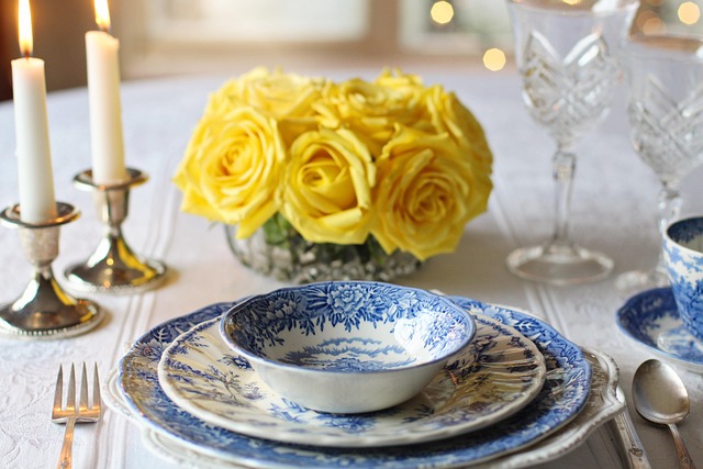 place setting at table with yellow flowers
