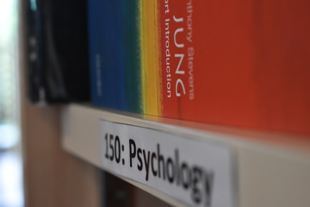 psychology books on a shelf