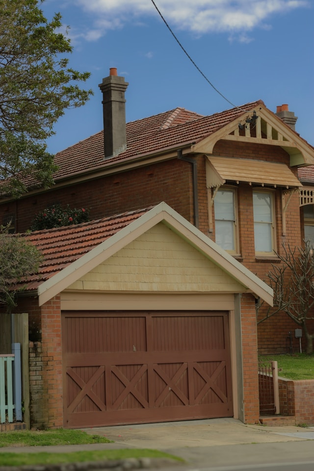 car garage attached to house with tiled roof