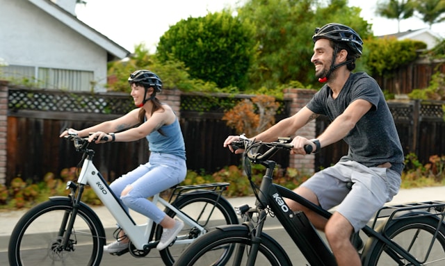 man and woman biking