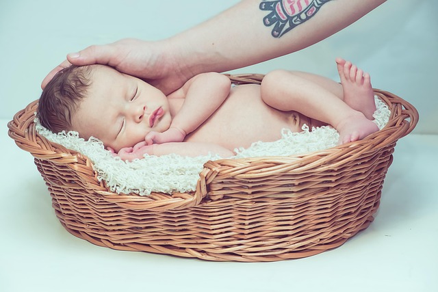 infant on blanket in a basket