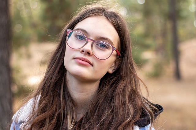 Pretty woman with long brown hair and glasses