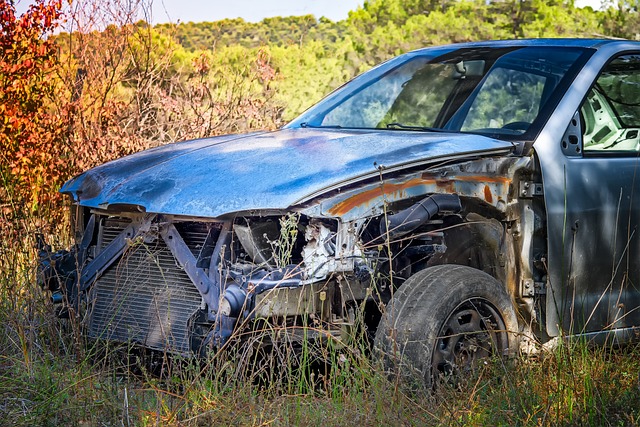 old car wrecked in field