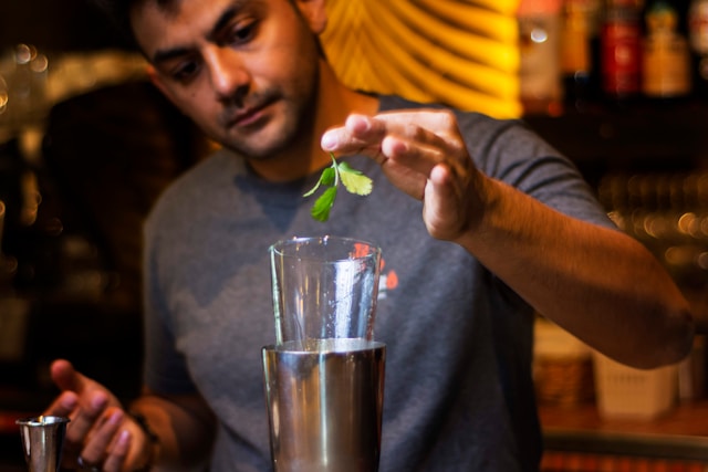 man mixing a drink