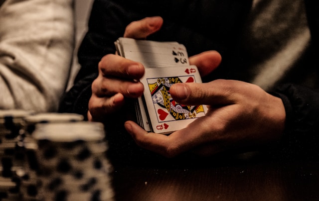 close-up of hands shuffling cards