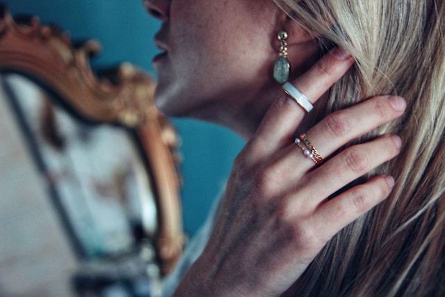 close-up of attractive blonde woman wearing jewelry