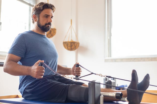 man in blue shirt exercising