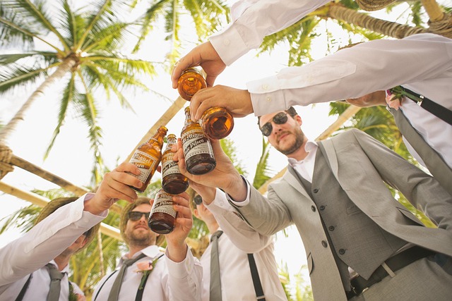 groom and groomsmen toasting
