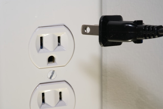 electrical outlet and plug about to be put in