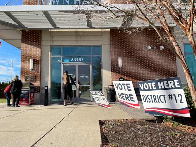woman entering voting area