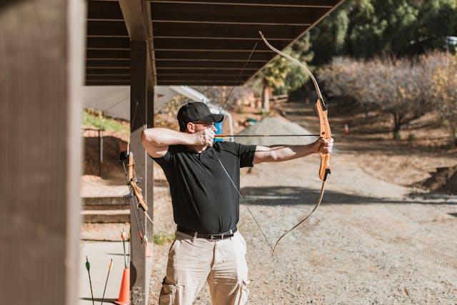 hunter practicing with a bow and arrow