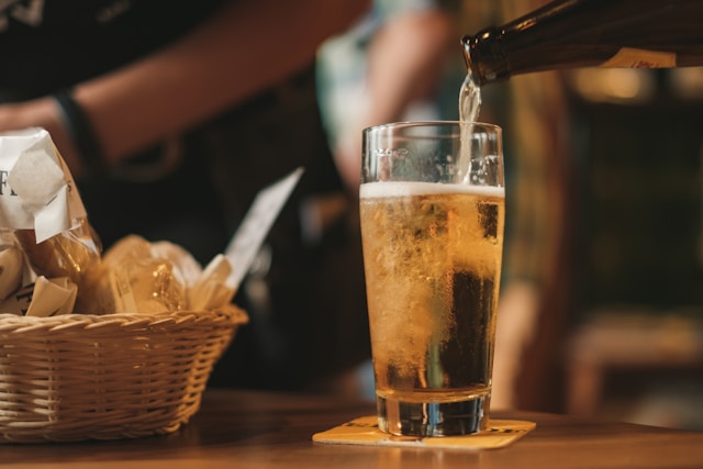 pouring beer into a glass