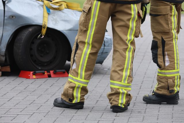 closeup of legs of firefighters at accident scene