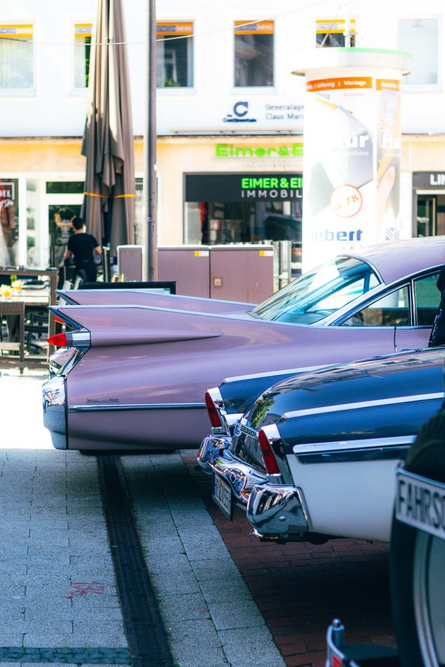 rear view of classic cars parked in city