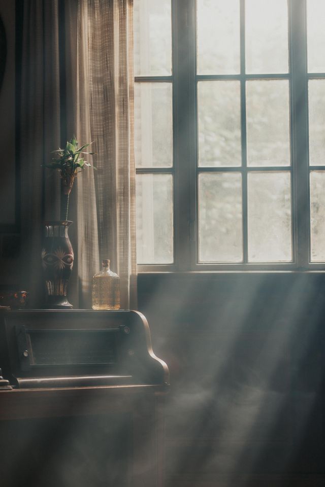 sunlight streaming through a windo in a room