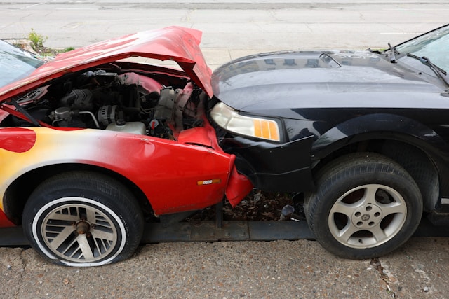 two crashed cars in frontal collision