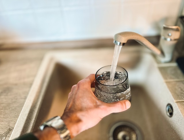 getting glass of water from faucet