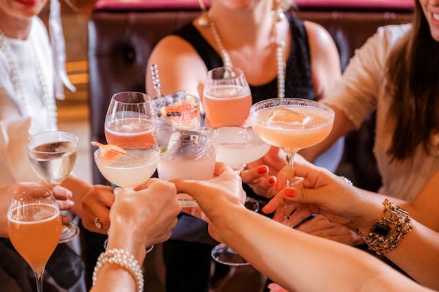 women doing toast with cocktails
