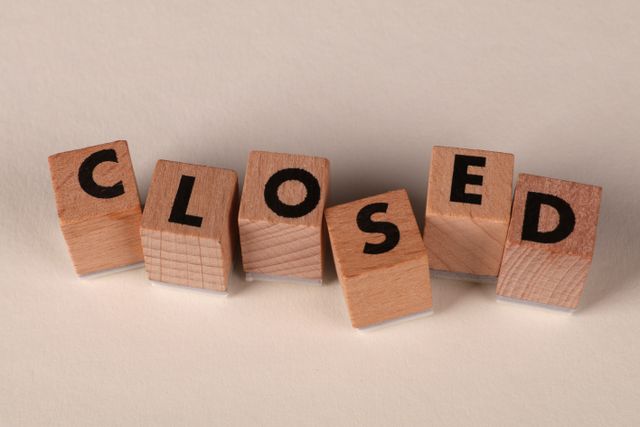 wooden blocks spelling out CLOSED