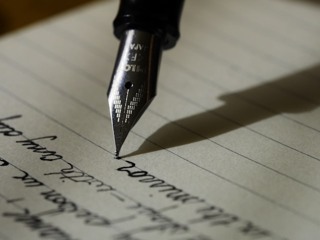 writing on paper with a fountain pen