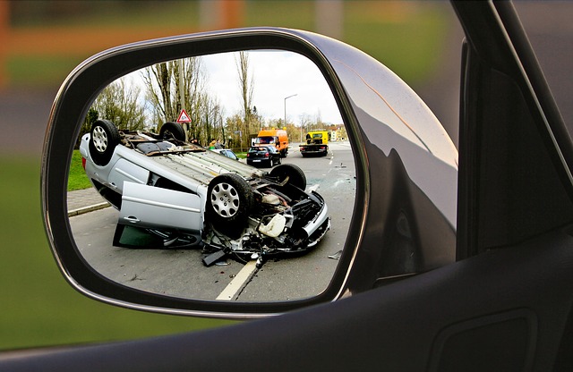car accident in rear-view mirror