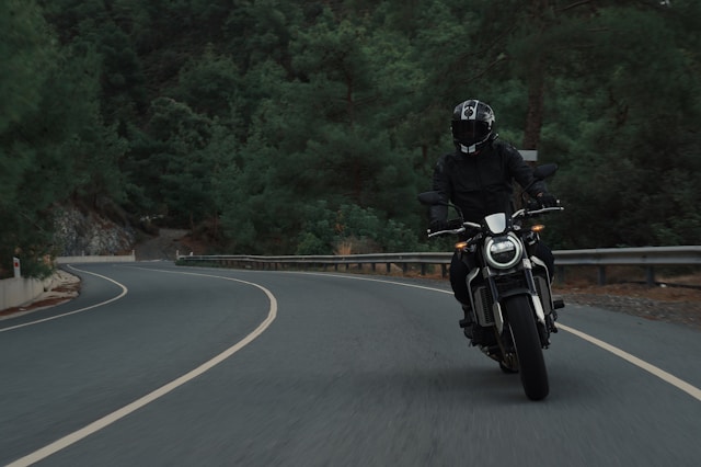 man on motorcylcle on road