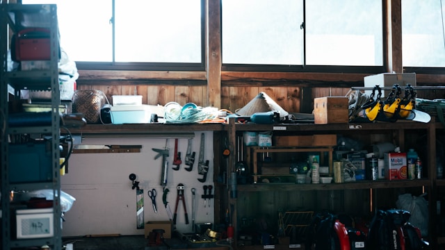 A man relaxing in a home garage workshop on a weekend afternoon