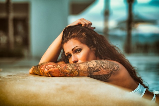 woman with arm tattoo