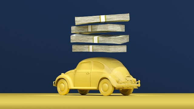 yellow toy car with stacks of money