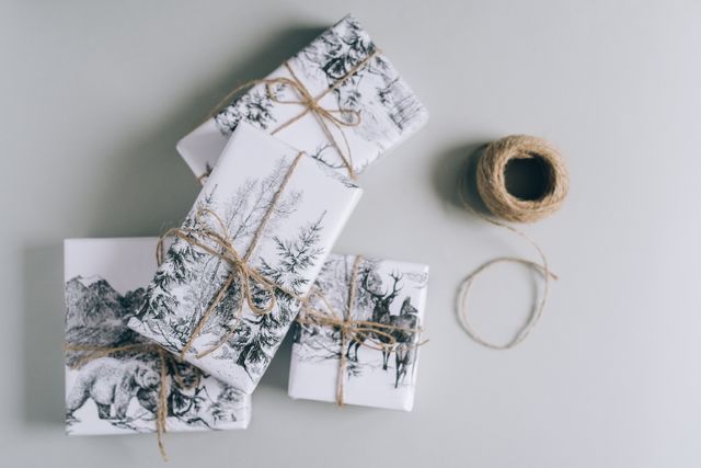 wrapped gift boxes and string